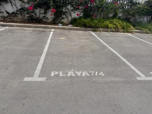 an empty parking lot with the word playania on it at Playa 7 in Martil