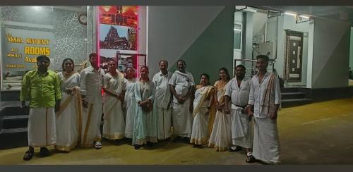 a group of people posing for a picture at Sri Aksha Residency in Alāndurai