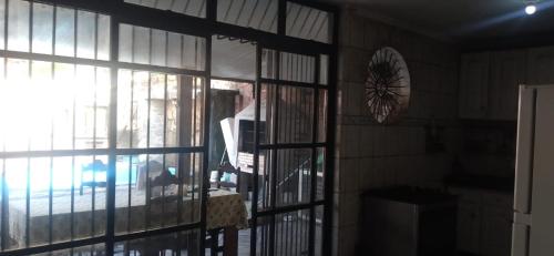 a person is looking out of a glass door at Cop 30 in Belém