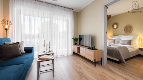 Postel nebo postele na pokoji v ubytování Jantar Resort Flatbook - Wynajem Apartamentów nad Morzem