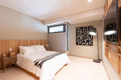 a bedroom with a large bed and a window at Punto Nima, Spectacular Pool with Ocean View in San José del Cabo