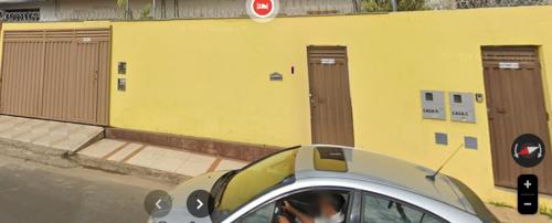 a car with a panda bear on the side of the road at Kitnet - Apart Hotel 3 in Sete Lagoas
