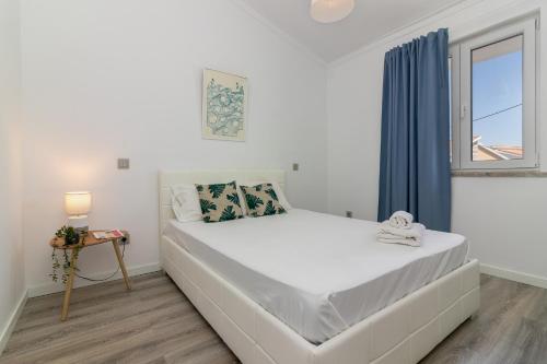 Postel nebo postele na pokoji v ubytování Casa Azeitao