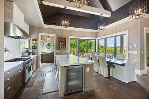 a large kitchen with a large island and a dining room at AV9-02: 9 2nd Avenue in Isle of Palms