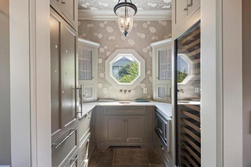 a kitchen with a sink and a window at AV9-02: 9 2nd Avenue in Isle of Palms