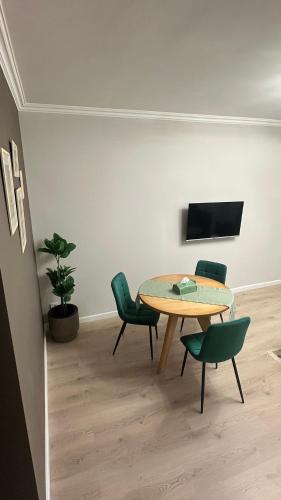 a dining room with a table and chairs at Luna Home in Jermuk