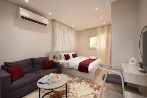 a living room with a bed and a couch at Luxury stay at a great price 88 by Spacey #71 in Cairo
