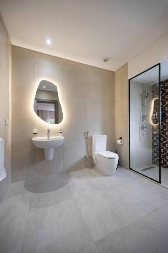 a bathroom with a toilet and a sink at Luxury stay at a great price 88 by Spacey #71 in Cairo