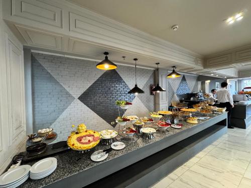 a buffet line with many different types of food at Oriental grand Plaza in Madinat Al Ashir min Ramadan