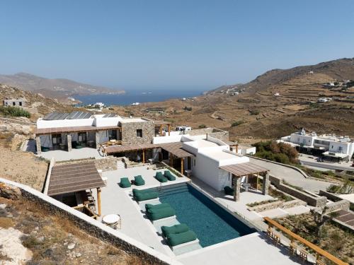 an aerial view of a house with a swimming pool at Mykonian Shades in Ano Mera
