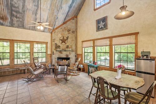 a large living room with a table and chairs at SisterCreek Ranch - Other Cabin in Boerne