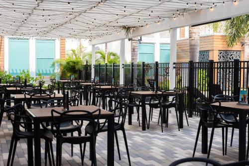 a row of tables and chairs on a patio at Kompose Boutique Resort @ Theme Parks in Kissimmee