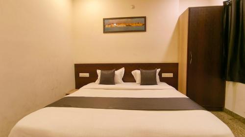 a bedroom with a large bed in a room at Hotel Udaipur Stay at Prime Location in Udaipur