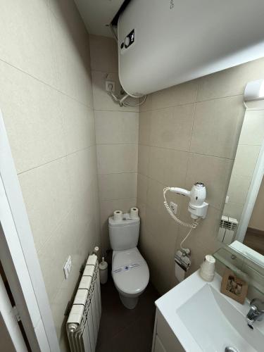 a bathroom with a toilet and a sink at Tetras by CONFORTSKY in Pas de la Casa