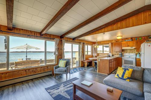 a living room with a couch and a table at Oceanfront Beauty in Blaine