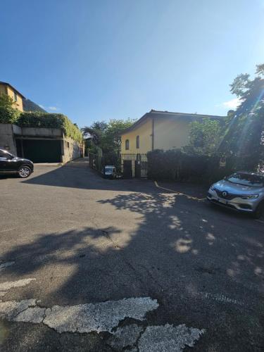 a street with a car parked in a driveway at Botanic Garden Lake Como in Blevio