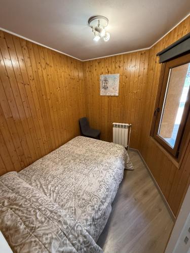 a bedroom with a bed and a window at Tetras by CONFORTSKY in Pas de la Casa