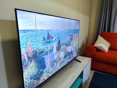 a large flat screen tv in a living room at Platinum Place in Kikuyu