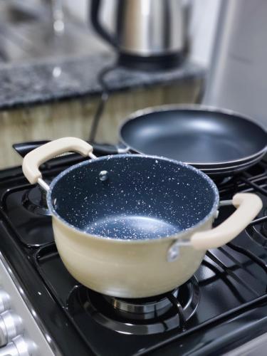 a pan sitting on top of a stove at Platinum Place in Kikuyu