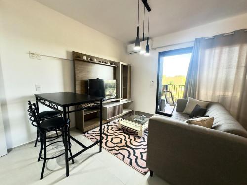 a living room with a table and a couch at Apartamento en Luque cerca de Asunción 219 in Luque