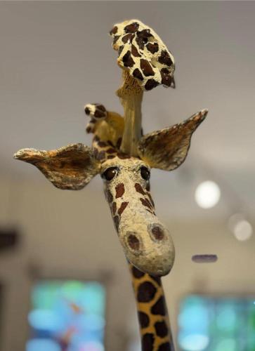 a puppet of a giraffe with a bird on its head at Dominical Beach 15 min Private Retreat Casa Grande in Platanillo