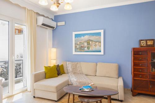 a living room with a couch and a table at Agora Apartment in Pythagoreio