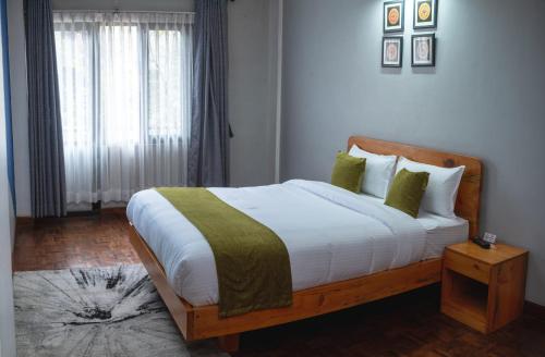 Llit o llits en una habitació de Dasko Shared Serviced Apartment