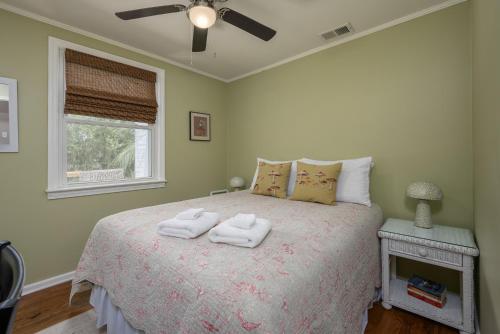 a bedroom with a bed with two towels on it at Cozy 3-Bedroom Retreat in Charming Beaufort, SC in Beaufort