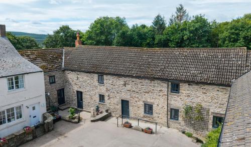 an overhead view of an old brick building with a courtyard at Rye Hill Farm in Hexham