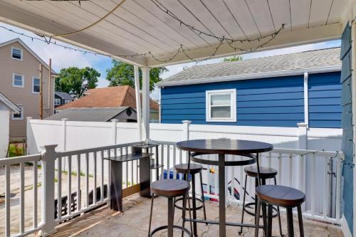 a patio with a table and stools under a canopy at 5 Mi to Dtwn Newark Hillside Vacation Rental in Hillside
