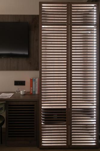 a large wooden closet with sliding doors in a room at Electra Hotel in Stavros