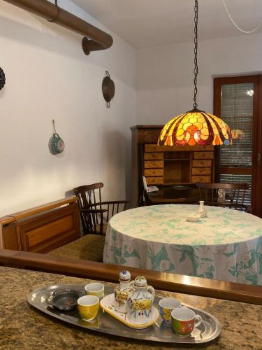 a kitchen with a table with a tray of food at PM 25 Via Trepene in Castellonorato