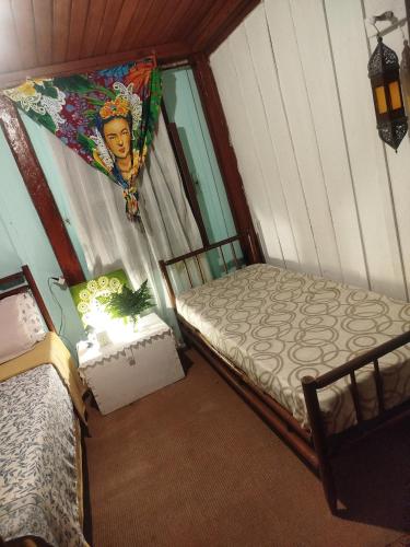 Una cama o camas en una habitación de Hospedaria da Chris