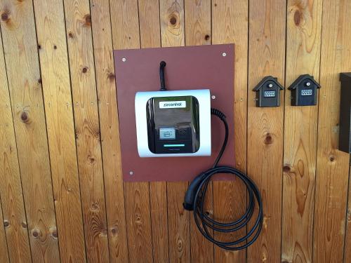 a pay phone hooked up to a wooden wall at Šipk -FREE-PARKING-BREAKFAST-TERRACE in Vojnik
