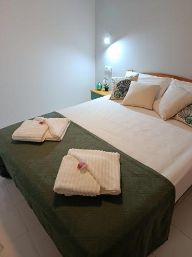 a bedroom with two beds with towels on them at BRISA DEL MAR en primera línea in Torres-Torres