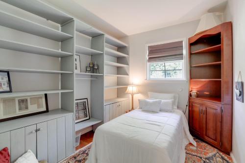 a bedroom with a bed and shelves at Walk to Restaurants New Hope Home with Deck and Yard! in New Hope