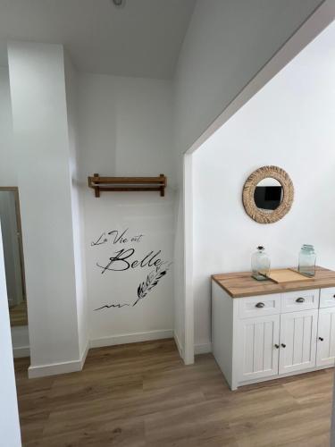 a room with a white wall with a sign that says we are rebels at Rondabella Luxury Parking Gratis Centro in Ronda