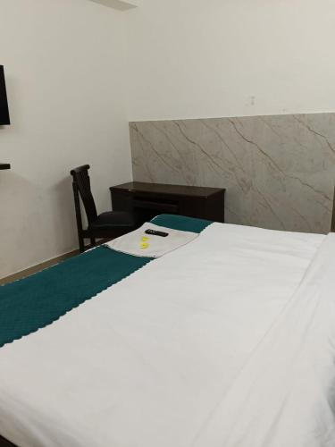 Ένα ή περισσότερα κρεβάτια σε δωμάτιο στο VK Hotel