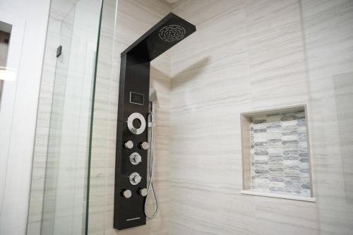 a glass shower in a bathroom with a window at Zephyrhills House for 4 people WiFi BBQ Mini Golf in Zephyrhills