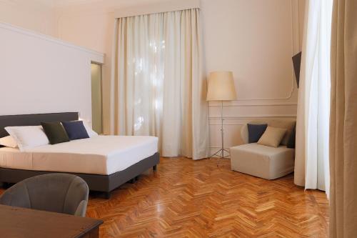 Кровать или кровати в номере Villa Maria Teresa Boutique Hotel