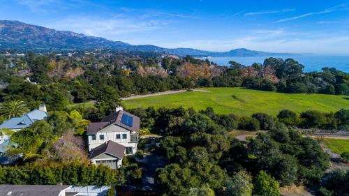 an aerial view of a house with a green field at Sea Steppe by Paradise Retreats in Montecito