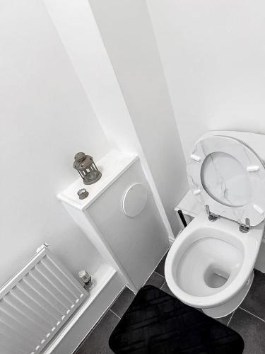 a small bathroom with a toilet with the lid up at 3BR with Ensuite & Downstairs WC in Litherland