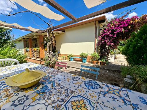 a patio with a table with a bowl on it at Casa Vacanze Podere Radici in Velletri