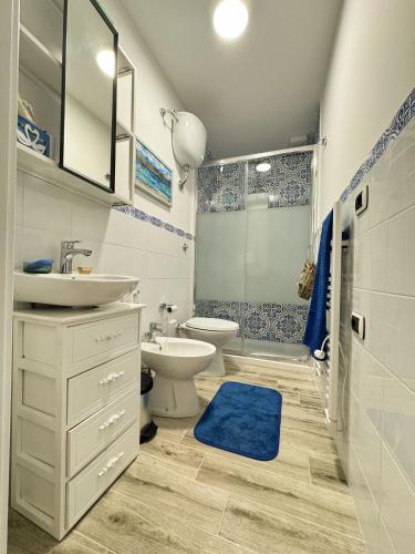 a bathroom with a sink and a toilet and a shower at Casa Vacanze Podere Radici in Velletri