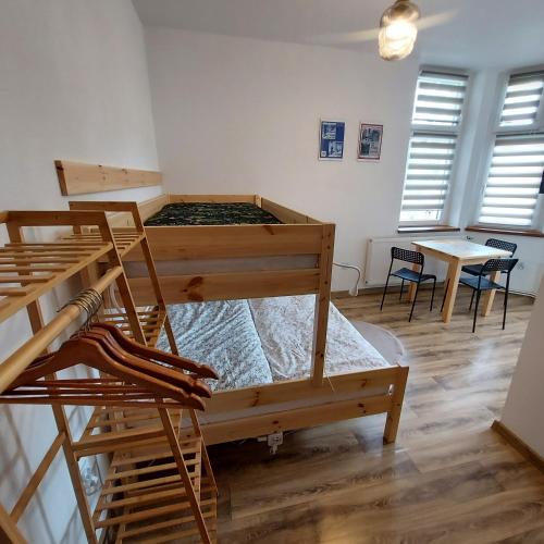 Postel nebo postele na pokoji v ubytování Roland Apartamenty