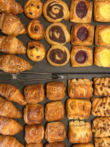 a bunch of different types of bread and pastries at Albergo Palazzo Costa in Beverino