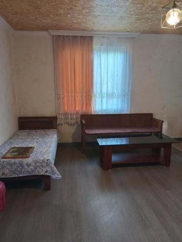 a room with two beds and a window at Шода in Gari