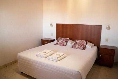 Ένα ή περισσότερα κρεβάτια σε δωμάτιο στο Hotel Cafayate