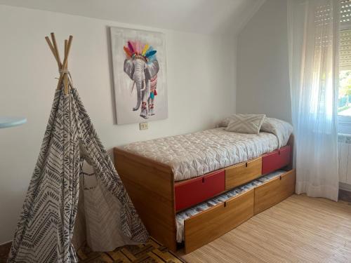 a bedroom with a bed and a tent in it at Casa PORTABERNA in Rianjo