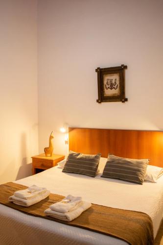 Ένα ή περισσότερα κρεβάτια σε δωμάτιο στο Hotel Cafayate